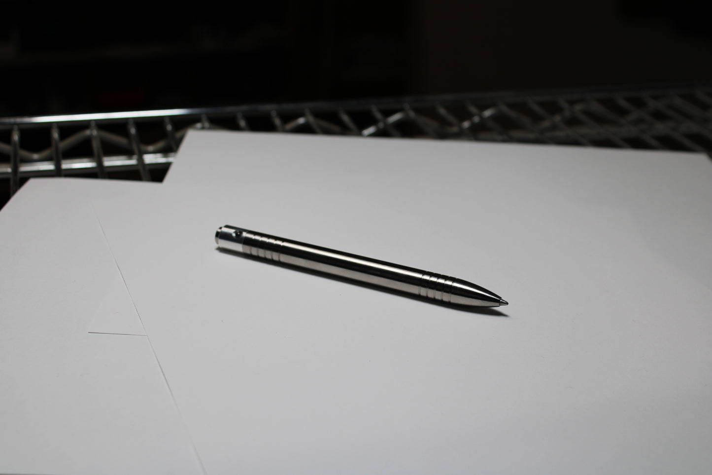 40 Clipless Click Pen - 6Al-4V Titanium - 6061 Aluminum Mechanism - Round Nose - Grip Lines - ISO G2 Schmidt EF9000 Refill