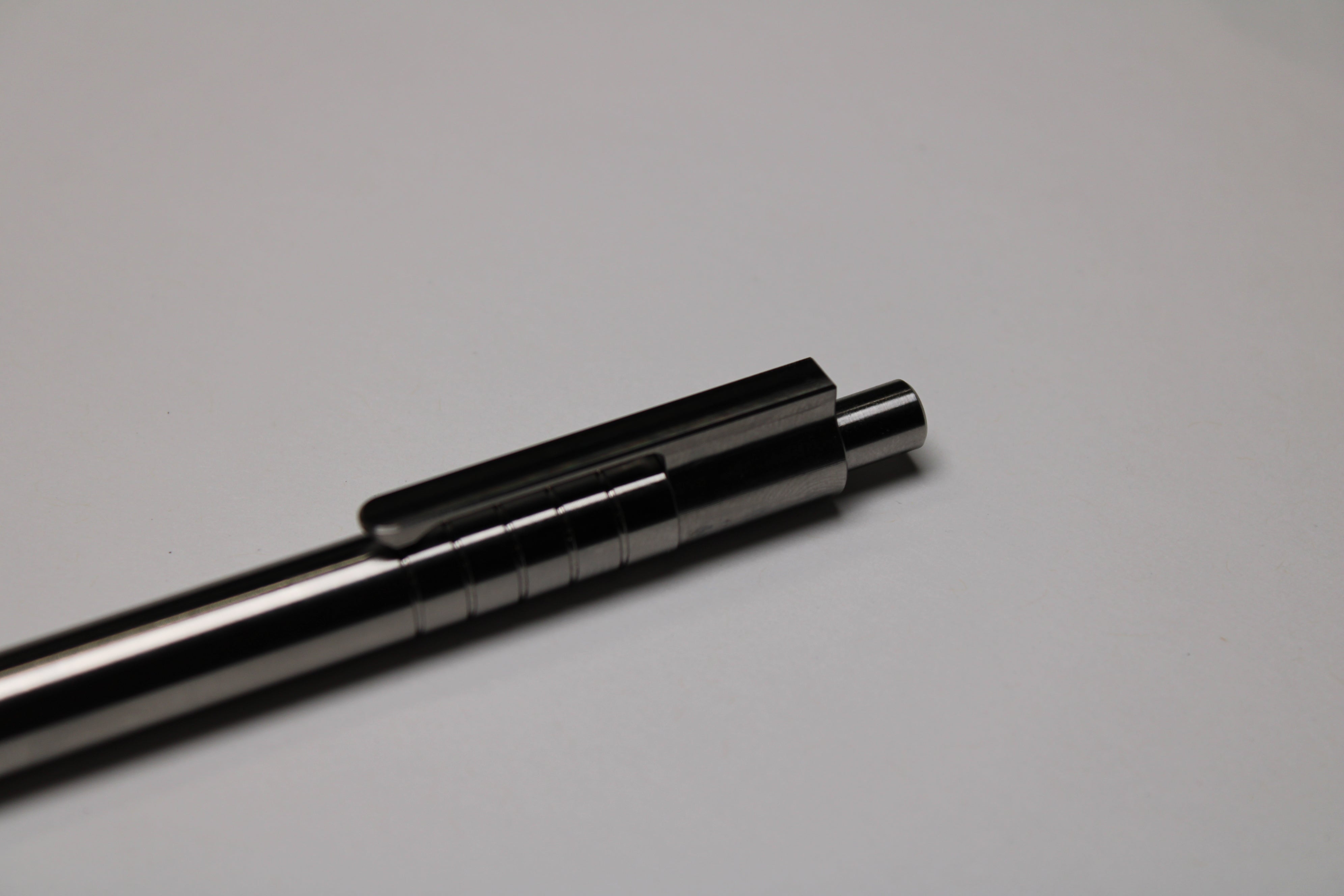 36 Click Clipped Pen - 6Al-4V Titanium - Step Nose - Grip Lines