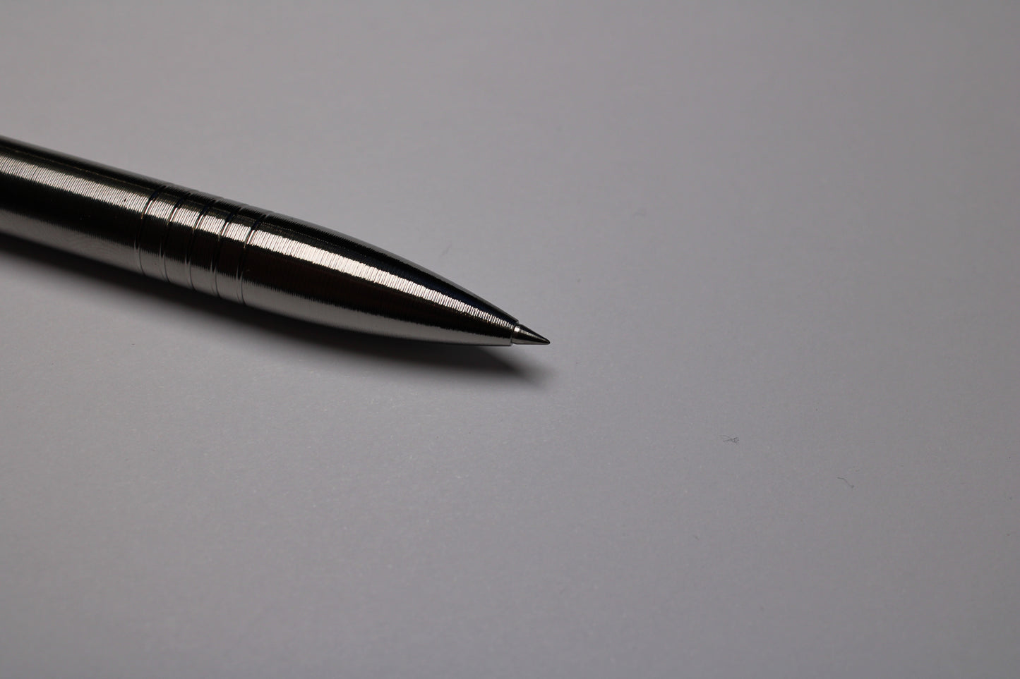 45 Clipless Click Pen - 6Al-4V Titanium  - Round Nose Grip Lines - C63000 Bronze Mechanism - Uni-Ball Signo UMR-83