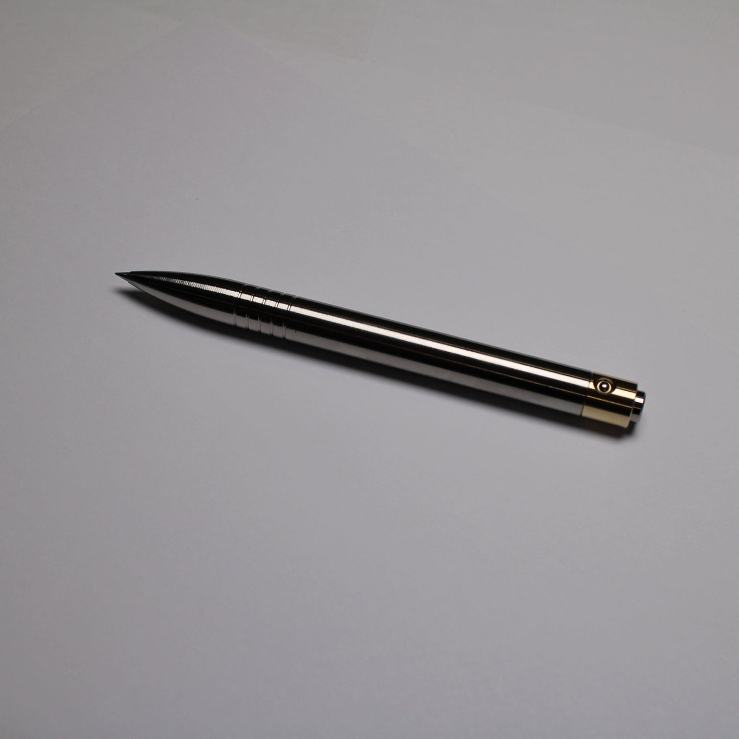 45 Clipless Click Pen - 6Al-4V Titanium  - Round Nose Grip Lines - C63000 Bronze Mechanism - Uni-Ball Signo UMR-83