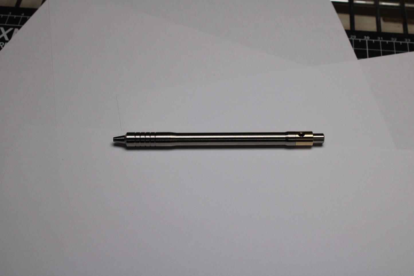38 Clipless Click Pen - 6Al-4V Titanium Recessed Body - Step Nose Grip Lines - C63000 Bronze Mechanism - Uni SXR-5