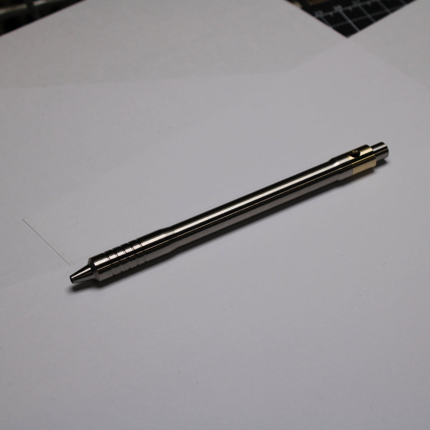 38 Clipless Click Pen - 6Al-4V Titanium Recessed Body - Step Nose Grip Lines - C63000 Bronze Mechanism - Uni SXR-5