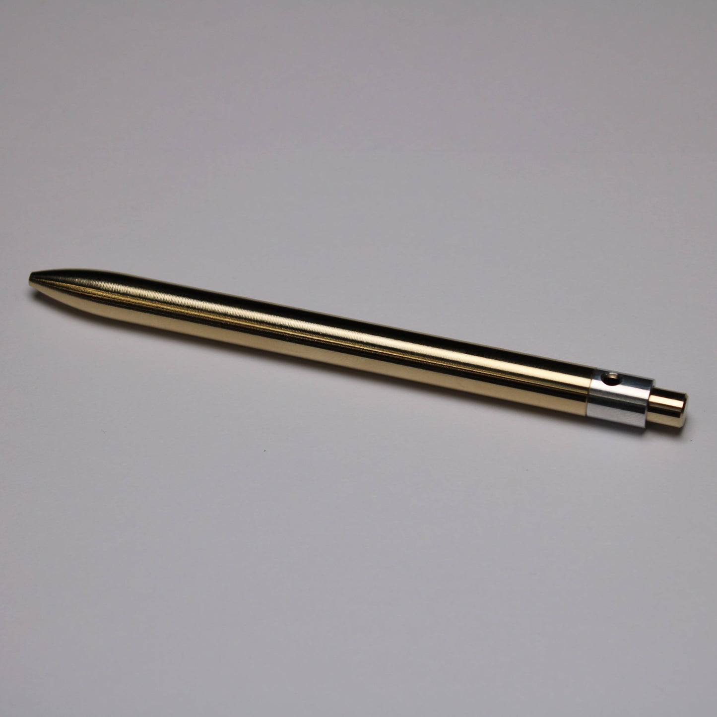 38 Clipless Click Pen - C63000 Bronze Round Nose Body And Button - 6061 Aluminum Mechanism - OHTO C-307 Rollerball Refill
