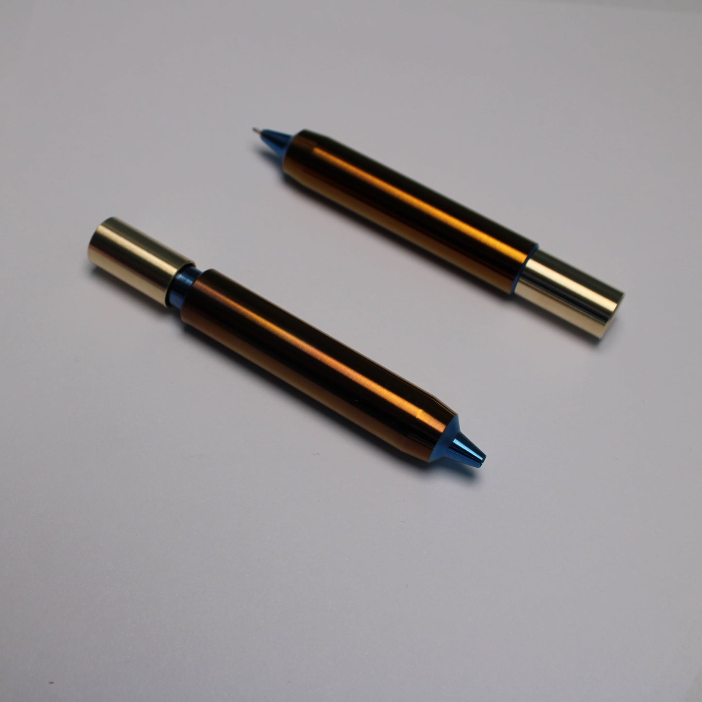 55 Clipless Twist Pen x KVR - 6Al-4V Titanium Body - C63000 Bronze Top - Triple Bevel Nose - OHTO Ceramic ISO G2